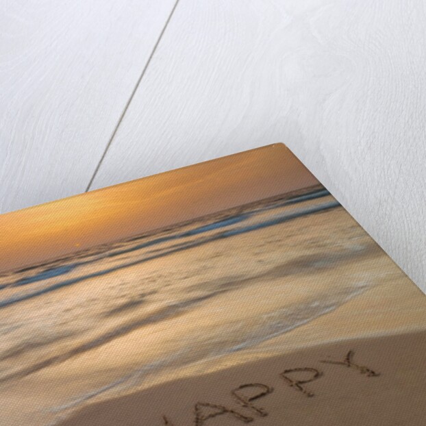 Sand writing on beach by Assaf Frank